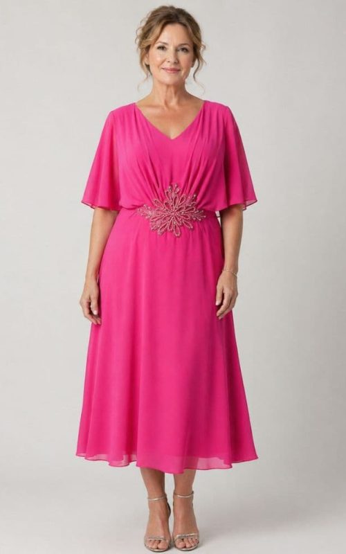 Model wearing L-22SS-2431-20 occasion dress in hot pink.
