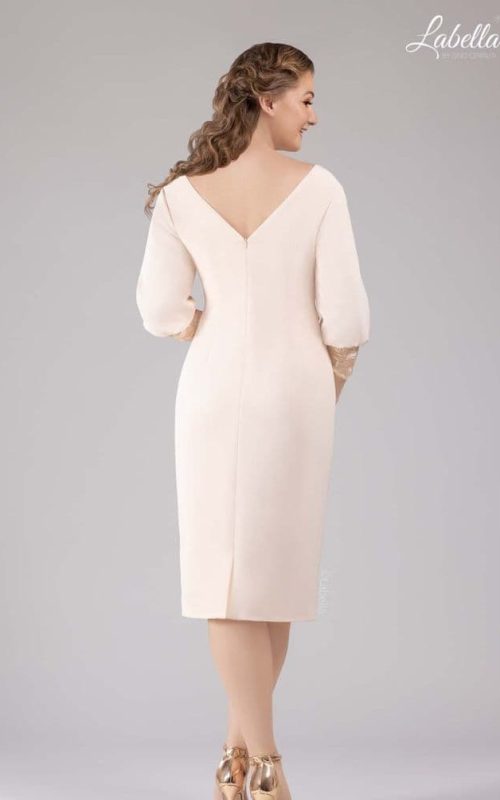 Model in rose gold occasion dress by Gino Cerruti.