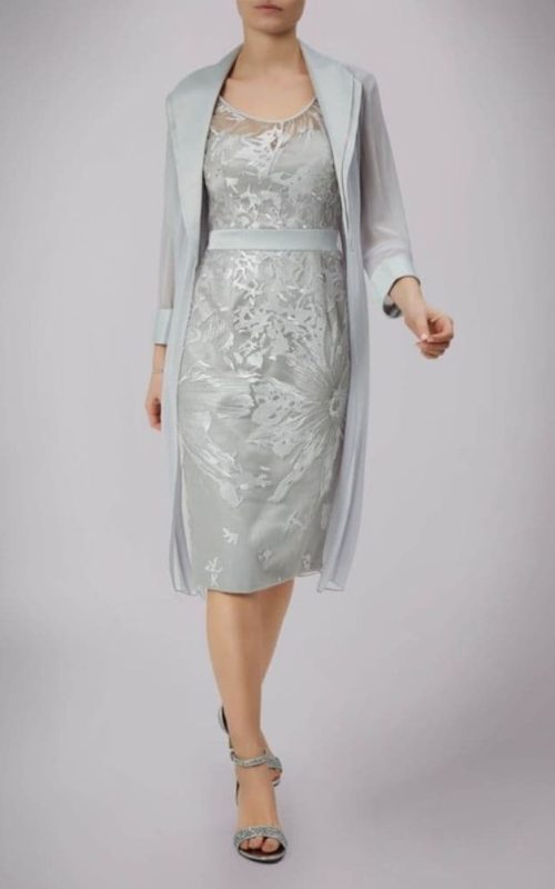 Model wearing Mascara occasion dress with jacket in silver.